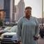 Tasha standing in a parking lot with the Nashville skyline behind her